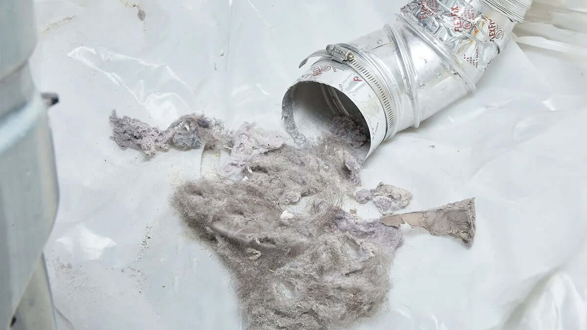 Why Your Dryer Takes Too Long to Dry and How Lint Build-Up Is to Blame